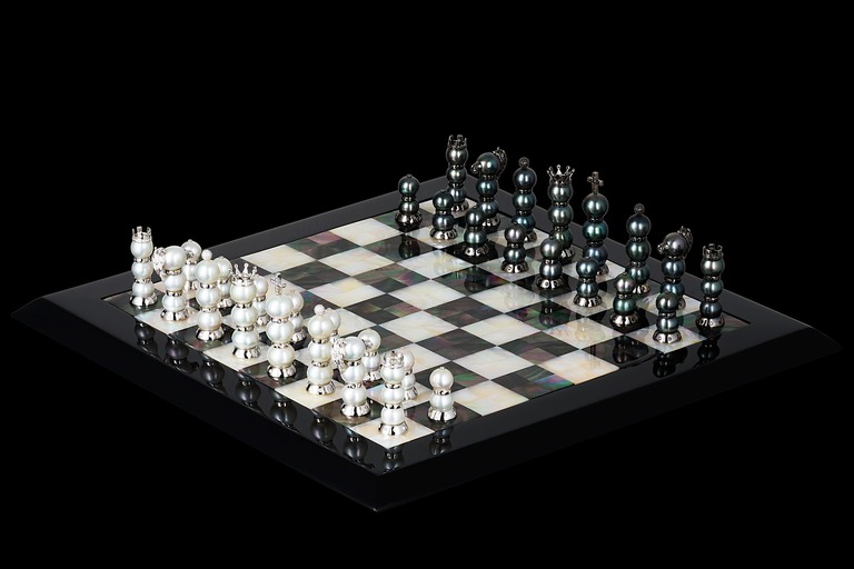 Professional photography of checkerboard in gold, diamonds and pearls by Arjuna Irsutti
