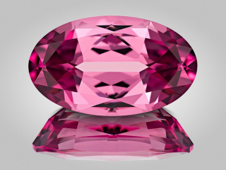 Professional gem photography of a purple garnet by Arjuna Irsutti