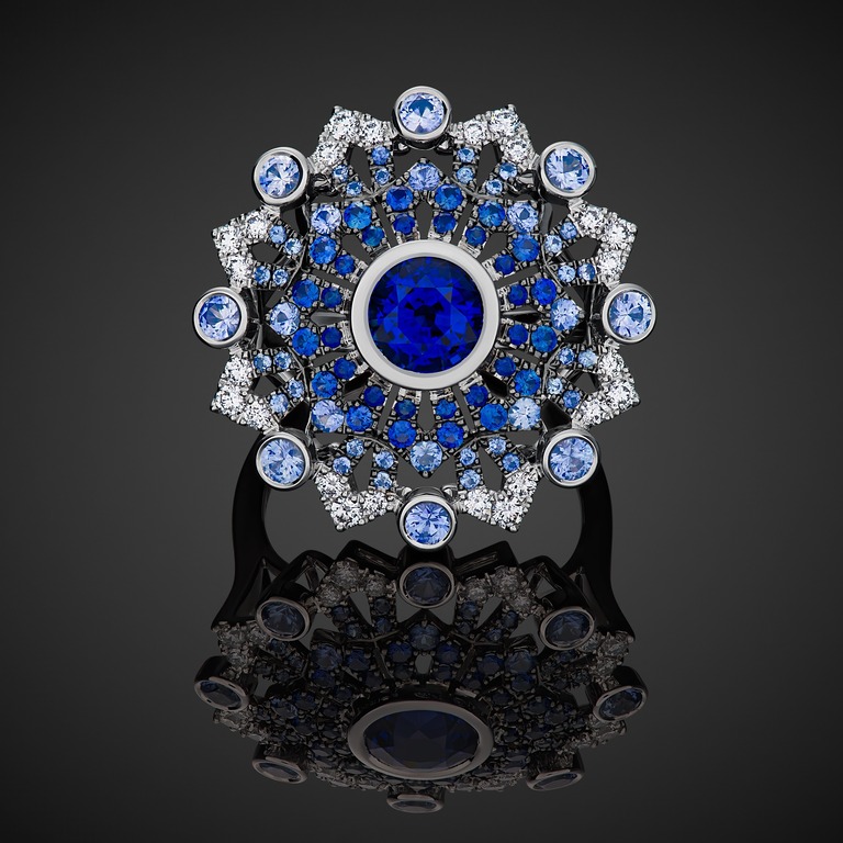 Professional jewelry photography of a ring with a blue sapphire by Arjuna Irsutti