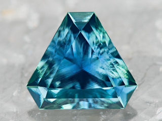 Professional gem photography of teal sapphire by Arjuna Irsutti